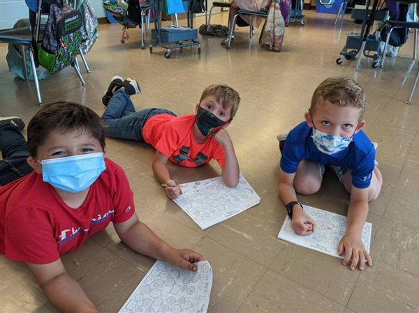 Students working on a paper